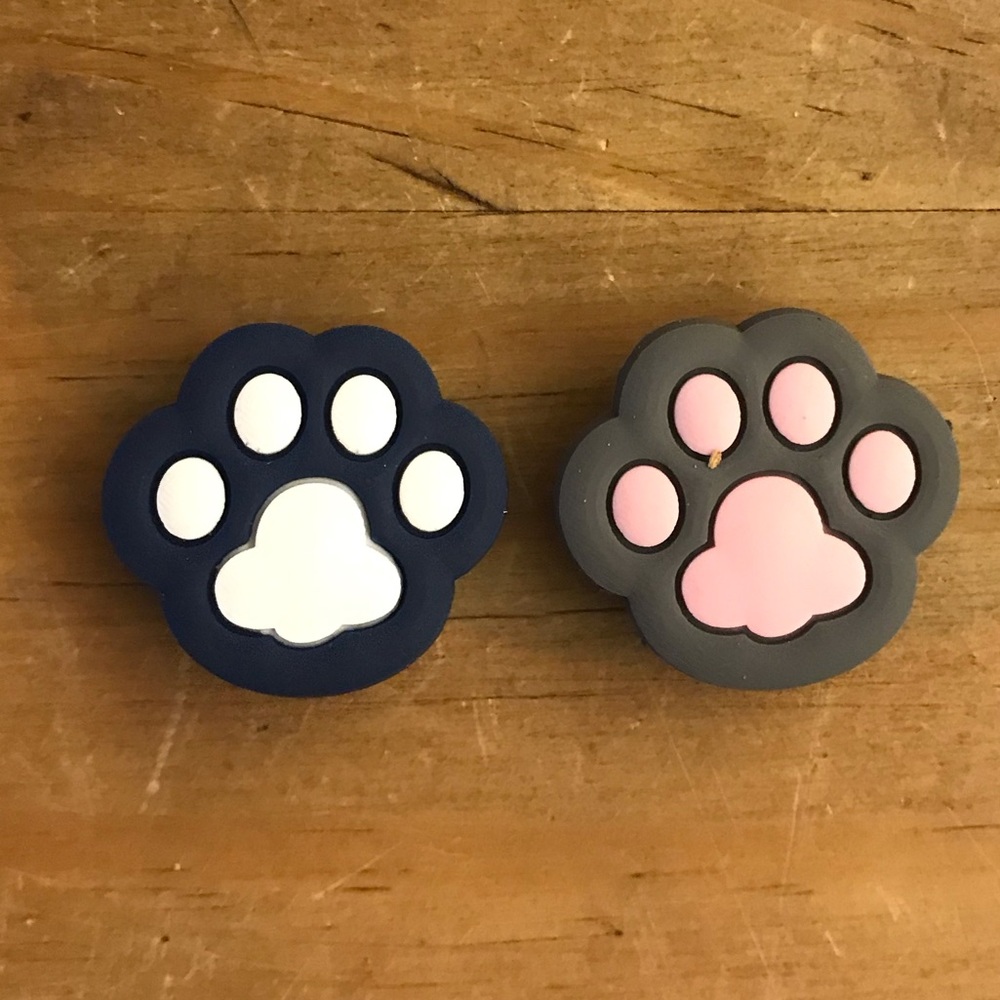 2 paw print Crocs Jibbitz charms